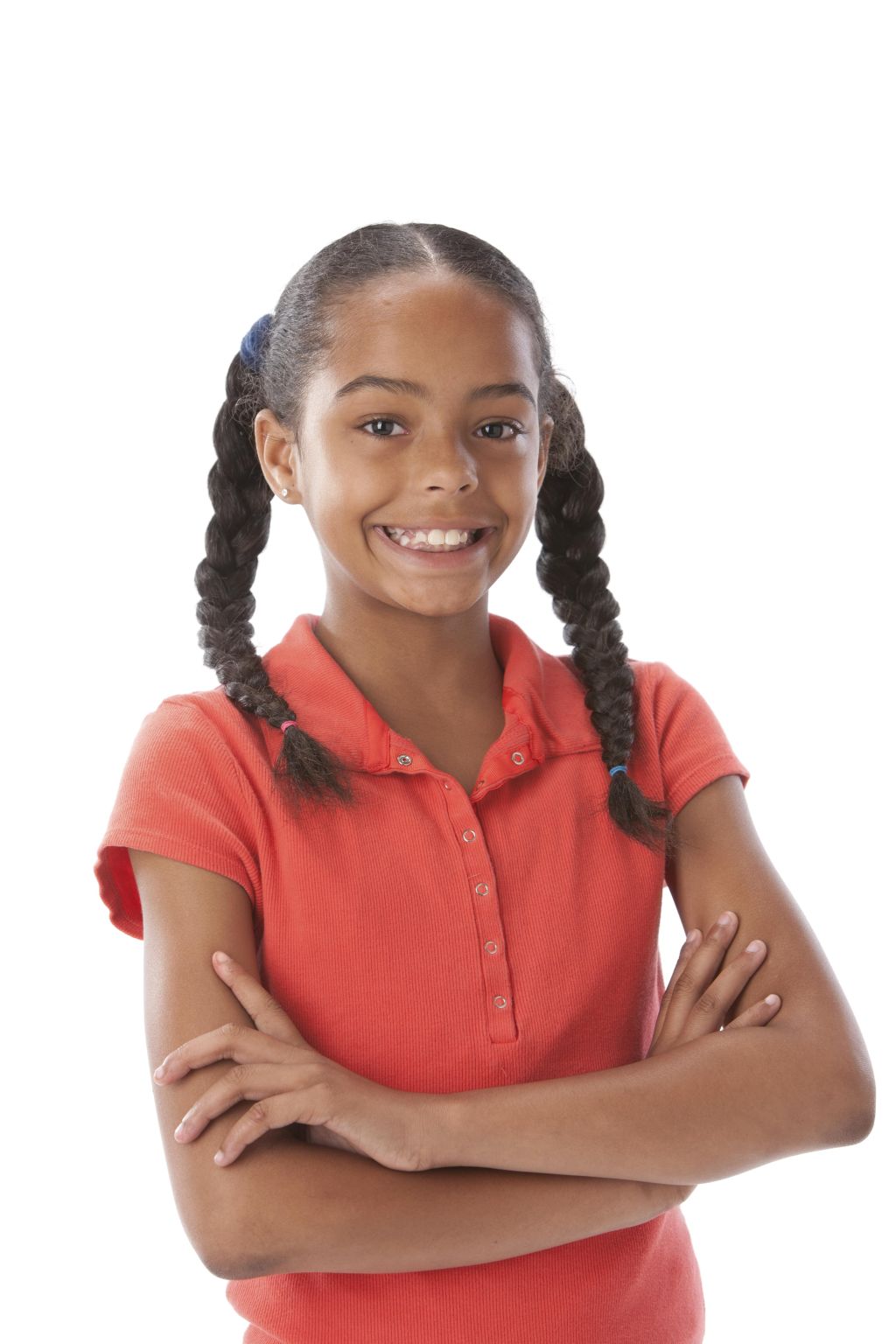 A head and shoulders image of a black little real girl with her arms crossed and a big smile on her face.