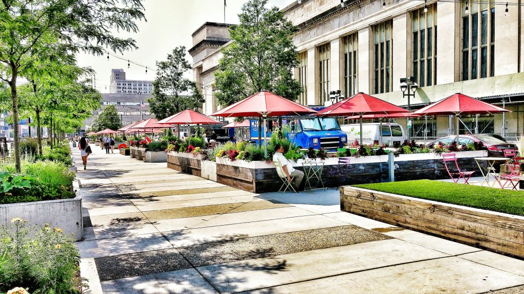 Sidewalk Cafe By Buildings In City