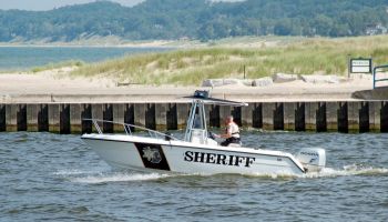 Sheriff boat patroling the waters of Lake Michigan at Manistee, Michigan