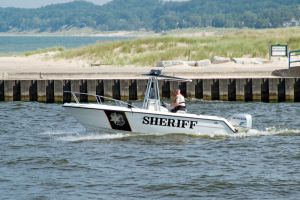 Sheriff boat patroling the waters of Lake Michigan at Manistee, Michigan