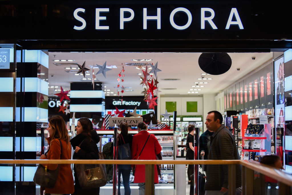 People are seen walking past the Sephora shop...