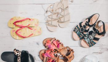 collection of female summer sandals top view