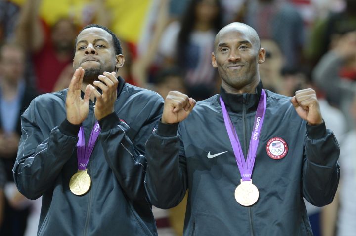 US Kobe Bryant (R) poses with his gold m