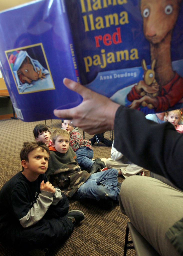 nolibrary_072_mac.jpg Kids front to back- Colin Lee, Nick Needham, Harlie Latham, Wyatt Latham and Hannah Joseph far right. Branch Supervisor Lori Hettman, reads" llama llama red pajama" book to the children. Jackson county in southern Oregon, just acro